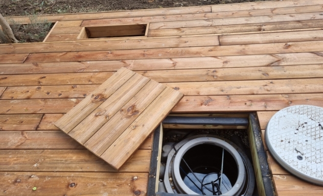 Création de terrasse bois avec cuve de récupération d'eau à Francheville